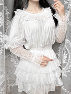 This retro-inspired blouse blends soft cotton with delicate mesh panels for textured elegance. The round neckline and relaxed fit offer timeless comfort, while subtle vintage details create a versatile layering piece. Perfect under jumpers or dresses, it effortlessly bridges classic and sweet Lolita styles with understated sophistication.