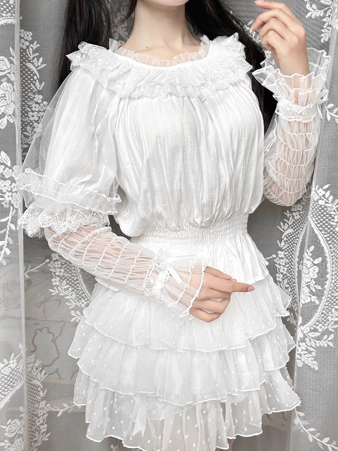 This retro-inspired blouse blends soft cotton with delicate mesh panels for textured elegance. The round neckline and relaxed fit offer timeless comfort, while subtle vintage details create a versatile layering piece. Perfect under jumpers or dresses, it effortlessly bridges classic and sweet Lolita styles with understated sophistication.