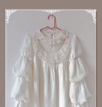Design Concept:
This Lolita blouse combines elegance and romantic charm with lotus leaf cuffs, hollow lace detailing, and loose chiffon sleeves. Available in apricot, white, and the generated color, the blouse offers a versatile and airy silhouette that enhances any Lolita outfit. Its soft, flowing fabric provides comfort while maintaining a delicate, refined look, making it ideal as an inner layer or standalone top for daily wear or tea party occasions.