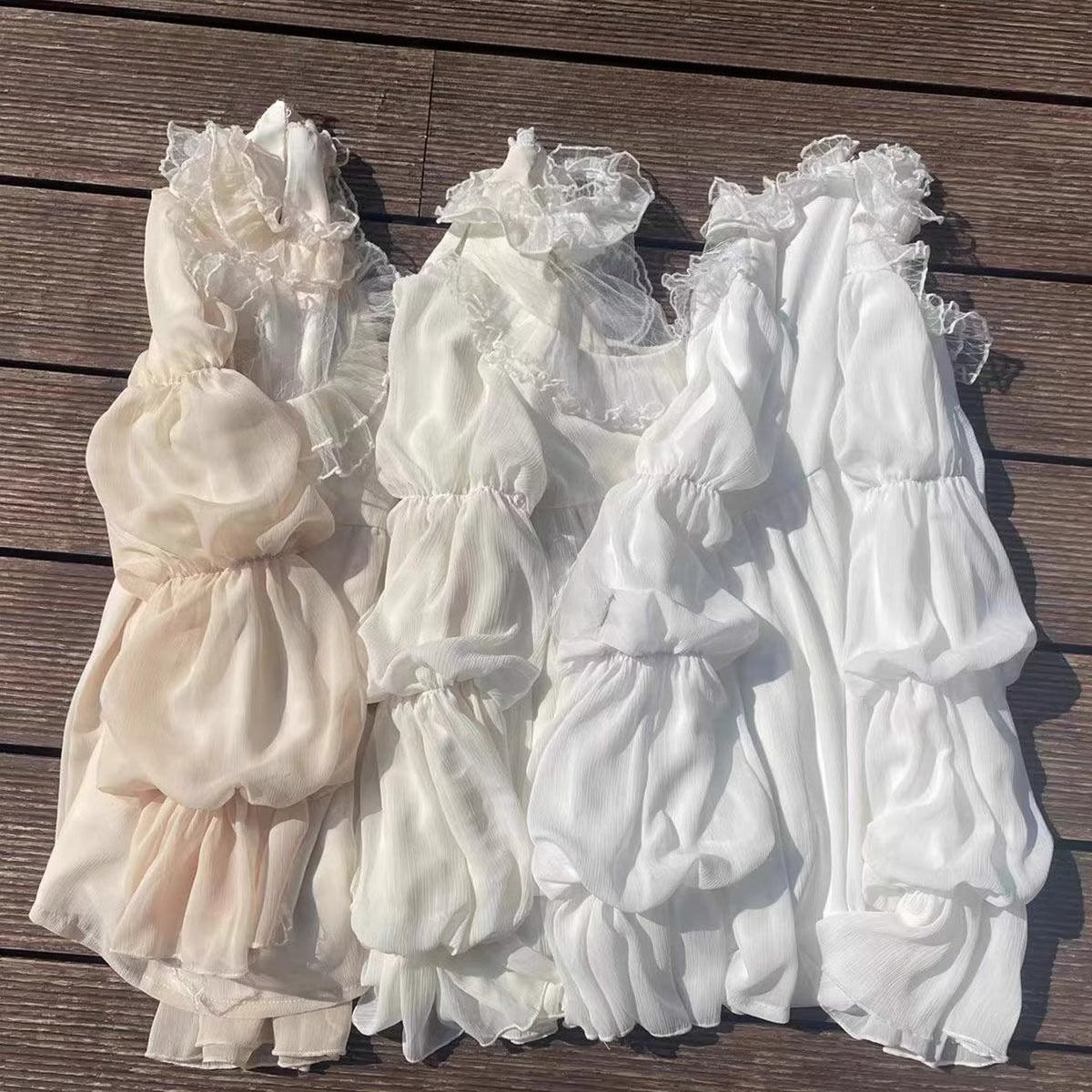 Design Concept:
This Lolita blouse combines elegance and romantic charm with lotus leaf cuffs, hollow lace detailing, and loose chiffon sleeves. Available in apricot, white, and the generated color, the blouse offers a versatile and airy silhouette that enhances any Lolita outfit. Its soft, flowing fabric provides comfort while maintaining a delicate, refined look, making it ideal as an inner layer or standalone top for daily wear or tea party occasions.