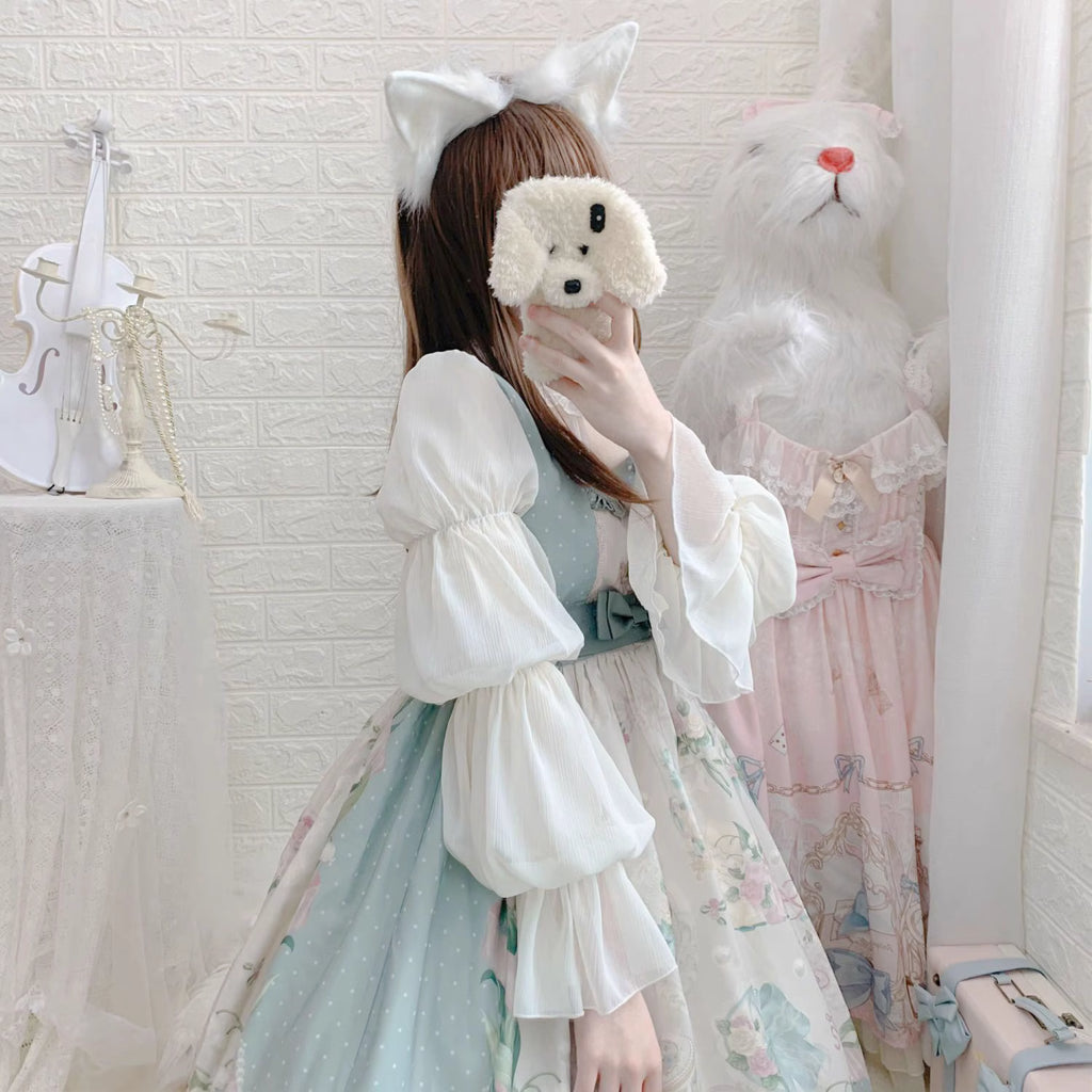 Design Concept:
This Lolita blouse combines elegance and romantic charm with lotus leaf cuffs, hollow lace detailing, and loose chiffon sleeves. Available in apricot, white, and the generated color, the blouse offers a versatile and airy silhouette that enhances any Lolita outfit. Its soft, flowing fabric provides comfort while maintaining a delicate, refined look, making it ideal as an inner layer or standalone top for daily wear or tea party occasions.