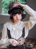 Elegance meets drama in this vintage-inspired Lolita blouse. The statement gigot sleeves create a sophisticated silhouette, perfect for achieving a classic romantic look. Crafted in a versatile beige hue, this blouse serves as an essential layering piece that complements any Lolita coordinate. Made from high-quality breathable fabric, it combines historical charm with modern comfort. Its timeless design makes it ideal for both casual wear and formal tea parties, offering effortless elegance.