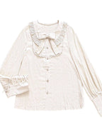 Elegance meets drama in this vintage-inspired Lolita blouse. The statement gigot sleeves create a sophisticated silhouette, perfect for achieving a classic romantic look. Crafted in a versatile beige hue, this blouse serves as an essential layering piece that complements any Lolita coordinate. Made from high-quality breathable fabric, it combines historical charm with modern comfort. Its timeless design makes it ideal for both casual wear and formal tea parties, offering effortless elegance.