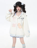 This adorable hoodie combines sweet lace accents with a playful kitten print in classic black and white. The relaxed fit and soft fabric offer everyday comfort, while the checkered pattern and lace details add a touch of romantic charm. Perfect for expressing a love for all things cute and cozy this autumn.