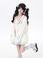 This adorable hoodie combines sweet lace accents with a playful kitten print in classic black and white. The relaxed fit and soft fabric offer everyday comfort, while the checkered pattern and lace details add a touch of romantic charm. Perfect for expressing a love for all things cute and cozy this autumn.