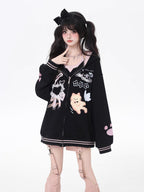 This adorable hoodie combines sweet lace accents with a playful kitten print in classic black and white. The relaxed fit and soft fabric offer everyday comfort, while the checkered pattern and lace details add a touch of romantic charm. Perfect for expressing a love for all things cute and cozy this autumn.