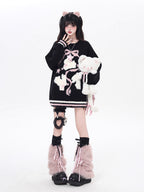 Playful yet provocative, this limited edition knit sweater blends childlike charm with a subtle dark edge. The classic round neck and soft fabric offer timeless comfort, while the contrasting red and black hues create a striking visual tension. Lightweight and versatile, it layers effortlessly under jackets or stands alone as a statement piece—perfect for expressing a duality of sweetness and rebellion.