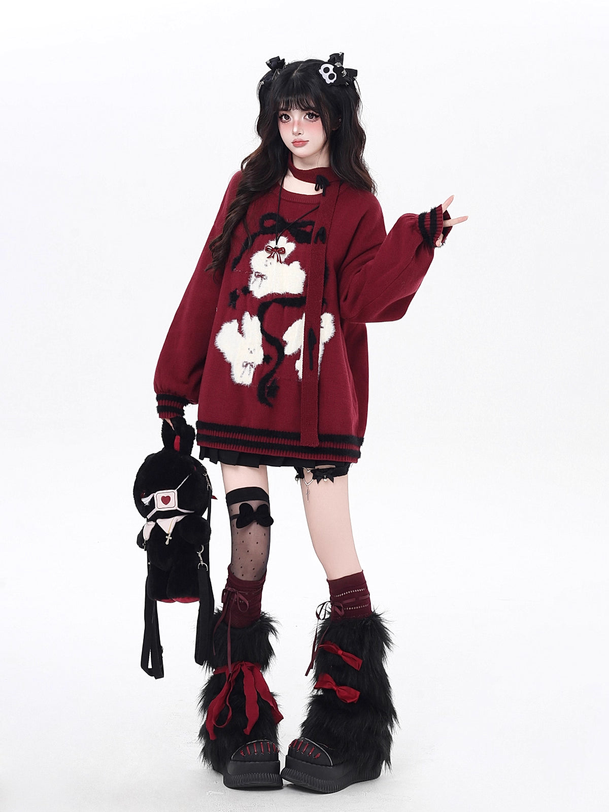Playful yet provocative, this limited edition knit sweater blends childlike charm with a subtle dark edge. The classic round neck and soft fabric offer timeless comfort, while the contrasting red and black hues create a striking visual tension. Lightweight and versatile, it layers effortlessly under jackets or stands alone as a statement piece—perfect for expressing a duality of sweetness and rebellion.