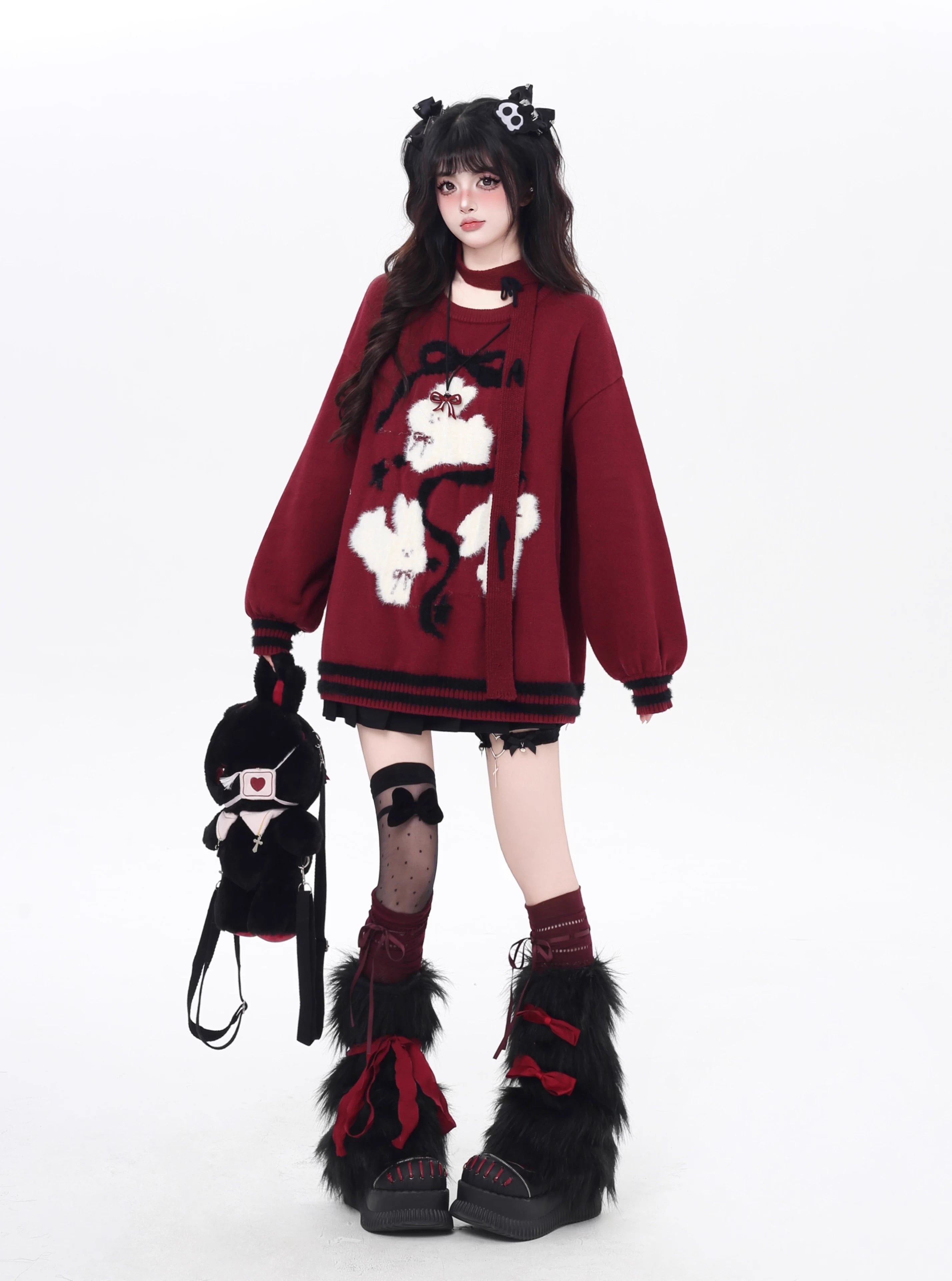 Playful yet provocative, this limited edition knit sweater blends childlike charm with a subtle dark edge. The classic round neck and soft fabric offer timeless comfort, while the contrasting red and black hues create a striking visual tension. Lightweight and versatile, it layers effortlessly under jackets or stands alone as a statement piece—perfect for expressing a duality of sweetness and rebellion.