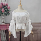 Design Concept:
This Lolita chiffon blouse brings a graceful and romantic aesthetic with its elastic neckline and off-shoulder design. The flowing silhouette enhances the charm of Lolita coordinates, while the gorgeous detailing adds a touch of elegance. Available in White and Black, it offers both a fresh, pure option and a dramatic, Gothic-inspired alternative.