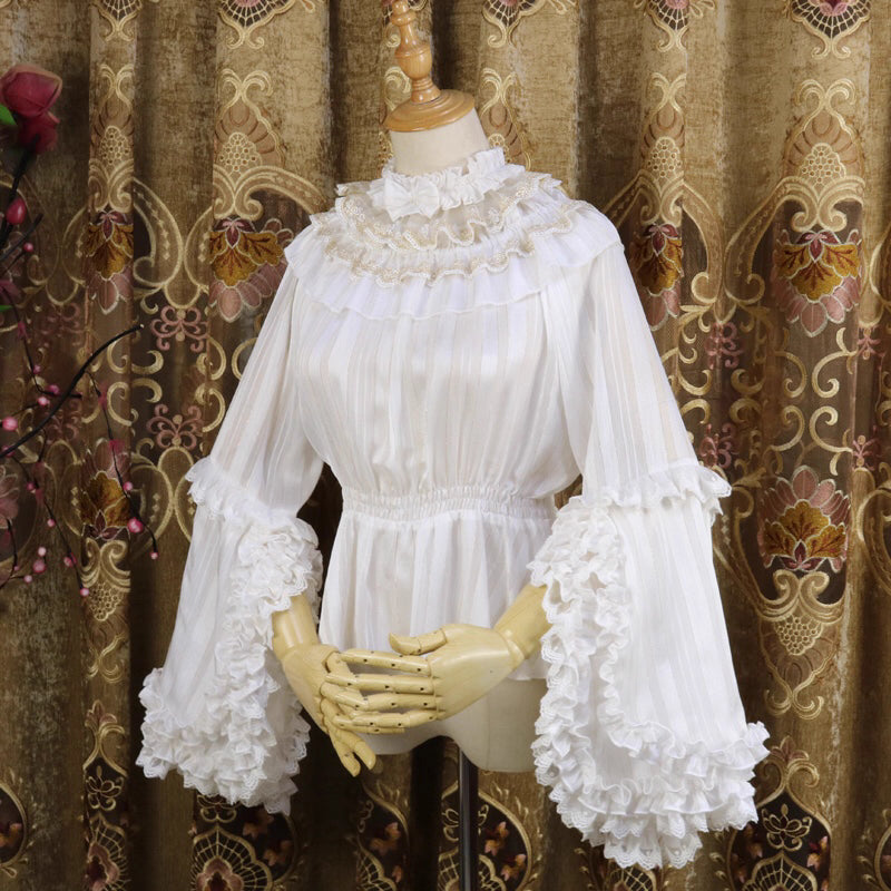 Design Concept:
This Lolita blouse features delicate gold-trimmed stripes on semi-sheer chiffon, creating a refined and elegant inner layer. The lightweight and slightly transparent design adds a luxurious touch while allowing versatile styling as a base layer for JSKs or skirts. Perfect for tea parties, daily outings, or seasonal events.