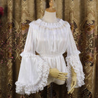 Design Concept:
This Lolita blouse features delicate gold-trimmed stripes on semi-sheer chiffon, creating a refined and elegant inner layer. The lightweight and slightly transparent design adds a luxurious touch while allowing versatile styling as a base layer for JSKs or skirts. Perfect for tea parties, daily outings, or seasonal events.