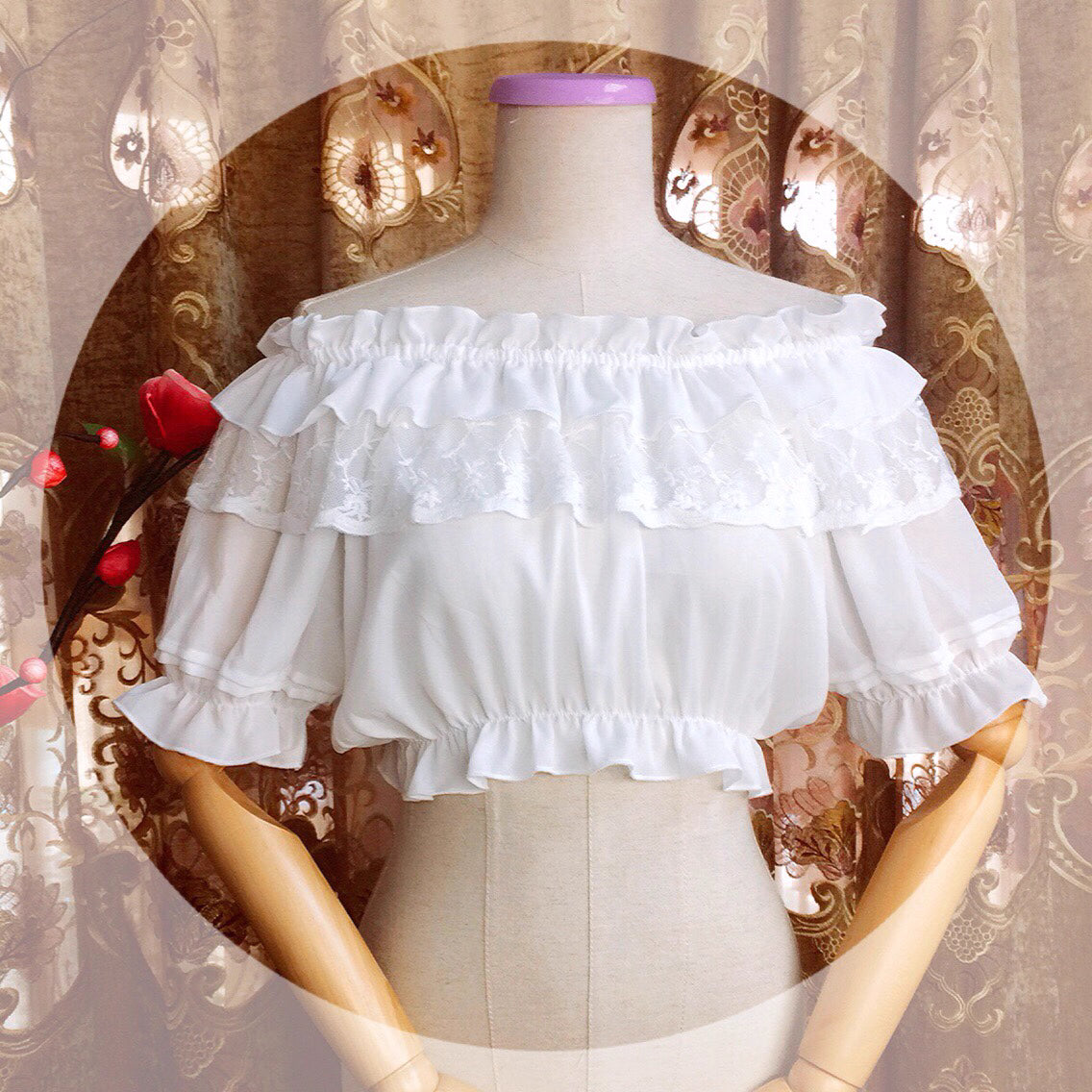 Design Concept:
This Lolita blouse features a ruffle-trimmed collar, round neckline, and short sleeves, designed as a high-waist pullover for a flattering, elegant silhouette. Crafted from lightweight chiffon with lace detailing, it adds a delicate, feminine touch to any Lolita outfit. Available in White, Apricot, and Black, it provides versatile styling options for sweet, classic, or Gothic-inspired looks.