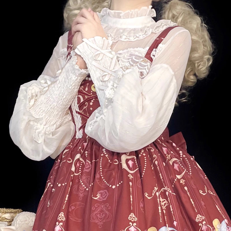 Design Concept:
This Lolita blouse combines classic elegance with a romantic touch, featuring soft chiffon fabric, graceful leg-of-mutton sleeves, and a refined stand collar. Available in Pure Ivory, Gold-Thread Ivory, and Pure Black, it brings versatile charm to both subtle and dramatic Lolita coordinates. The flowing silhouette and detailed construction make it perfect for layering under dresses or wearing as a statement piece on its own.