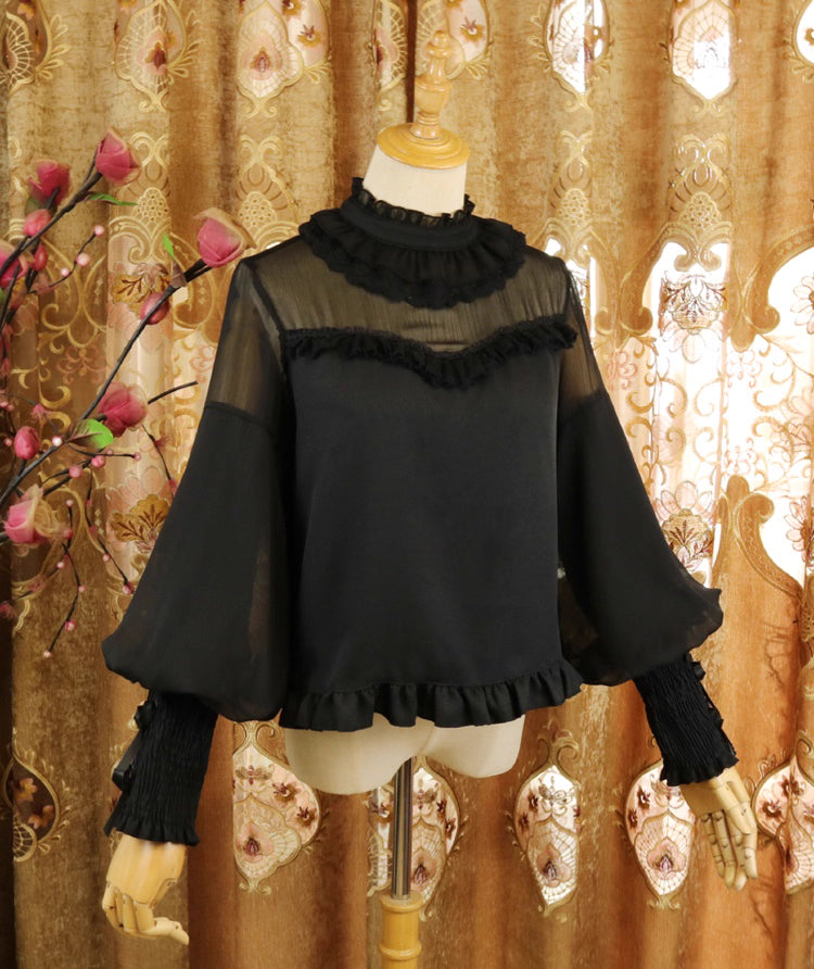 Design Concept:
This Lolita blouse combines classic elegance with a romantic touch, featuring soft chiffon fabric, graceful leg-of-mutton sleeves, and a refined stand collar. Available in Pure Ivory, Gold-Thread Ivory, and Pure Black, it brings versatile charm to both subtle and dramatic Lolita coordinates. The flowing silhouette and detailed construction make it perfect for layering under dresses or wearing as a statement piece on its own.