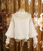Design Concept:
This Lolita blouse combines classic elegance with a romantic touch, featuring soft chiffon fabric, graceful leg-of-mutton sleeves, and a refined stand collar. Available in Pure Ivory, Gold-Thread Ivory, and Pure Black, it brings versatile charm to both subtle and dramatic Lolita coordinates. The flowing silhouette and detailed construction make it perfect for layering under dresses or wearing as a statement piece on its own.