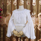 Design Concept:
This short chiffon Lolita blouse is designed with a romantic off-shoulder silhouette, combining lightness and elegance. The cropped cut highlights the waistline, making it a perfect inner layer for JSKs or skirts. Available in White and Black, it balances sweetness and sophistication, offering versatile styling for different Lolita aesthetics.