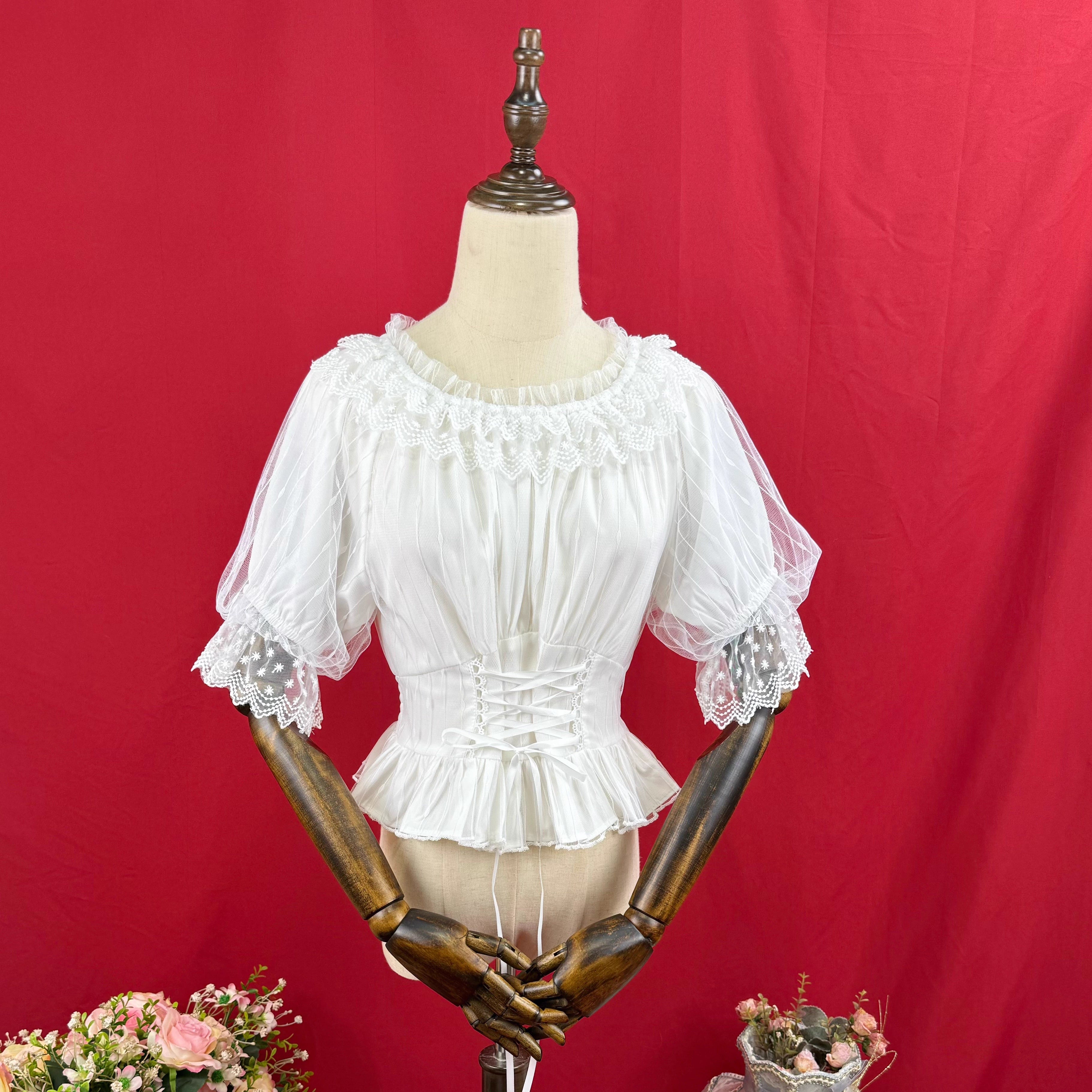Design Concept:
This Lolita blouse features a slim-fit silhouette with a soft elastic neckline and round collar, combining elegance with everyday wearability. The short sleeves and cropped length highlight a youthful charm while maintaining a refined Lolita aesthetic. Available in White and Apricot, it offers versatile styling options for different moods and outfits.