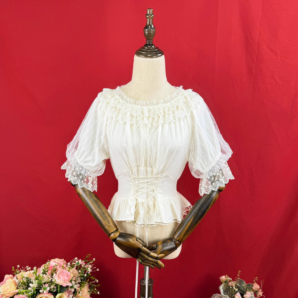 Design Concept:
This Lolita blouse features a slim-fit silhouette with a soft elastic neckline and round collar, combining elegance with everyday wearability. The short sleeves and cropped length highlight a youthful charm while maintaining a refined Lolita aesthetic. Available in White and Apricot, it offers versatile styling options for different moods and outfits.