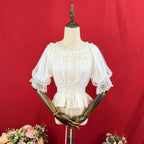 Design Concept:
This Lolita blouse features a slim-fit silhouette with a soft elastic neckline and round collar, combining elegance with everyday wearability. The short sleeves and cropped length highlight a youthful charm while maintaining a refined Lolita aesthetic. Available in White and Apricot, it offers versatile styling options for different moods and outfits.