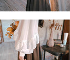 Inspired by the opulent elegance of the French court, this blouse is a masterpiece of romantic detail. Crafted in a subtly shimmering fabric, it features dramatic puff sleeves and delicate ruffled accents. The adjustable tie-front closure allows for a customizable fit, blending historical grandeur with modern wearability. This piece is designed for those who wish to infuse their everyday style with a touch of aristocratic fantasy and timeless grace.