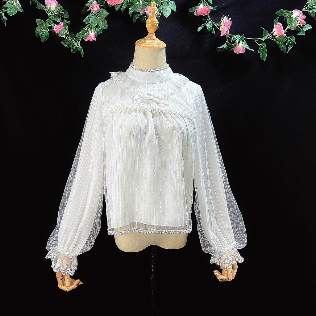 Design Concept:
This Lolita blouse combines gold-thread black and pure milk white into a refined and versatile design. Crafted from lightweight chiffon with a semi-high collar and delicate mesh overlay, it creates an elegant yet sweet atmosphere. The retro-inspired long sleeves flow gracefully with a soft silhouette, making it perfect for pairing with JSKs or skirts. Whether in shimmering gold-thread black for a dramatic gothic charm, or in pure milk white for a gentle and innocent look, this blouse adapts 