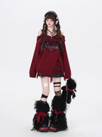 A daring twist on dark romance, this sweater blends gothic subversion with playful vibrancy. The structured zip collar frames off-shoulder styling for a bold yet elegant silhouette, while the unexpected red and pink hues reinterpret traditional gothic tones. Lightweight yet textured knit offers versatility for layered winter wear. For those who embrace contrast—where edge meets elegance, and rebellion meets softness.