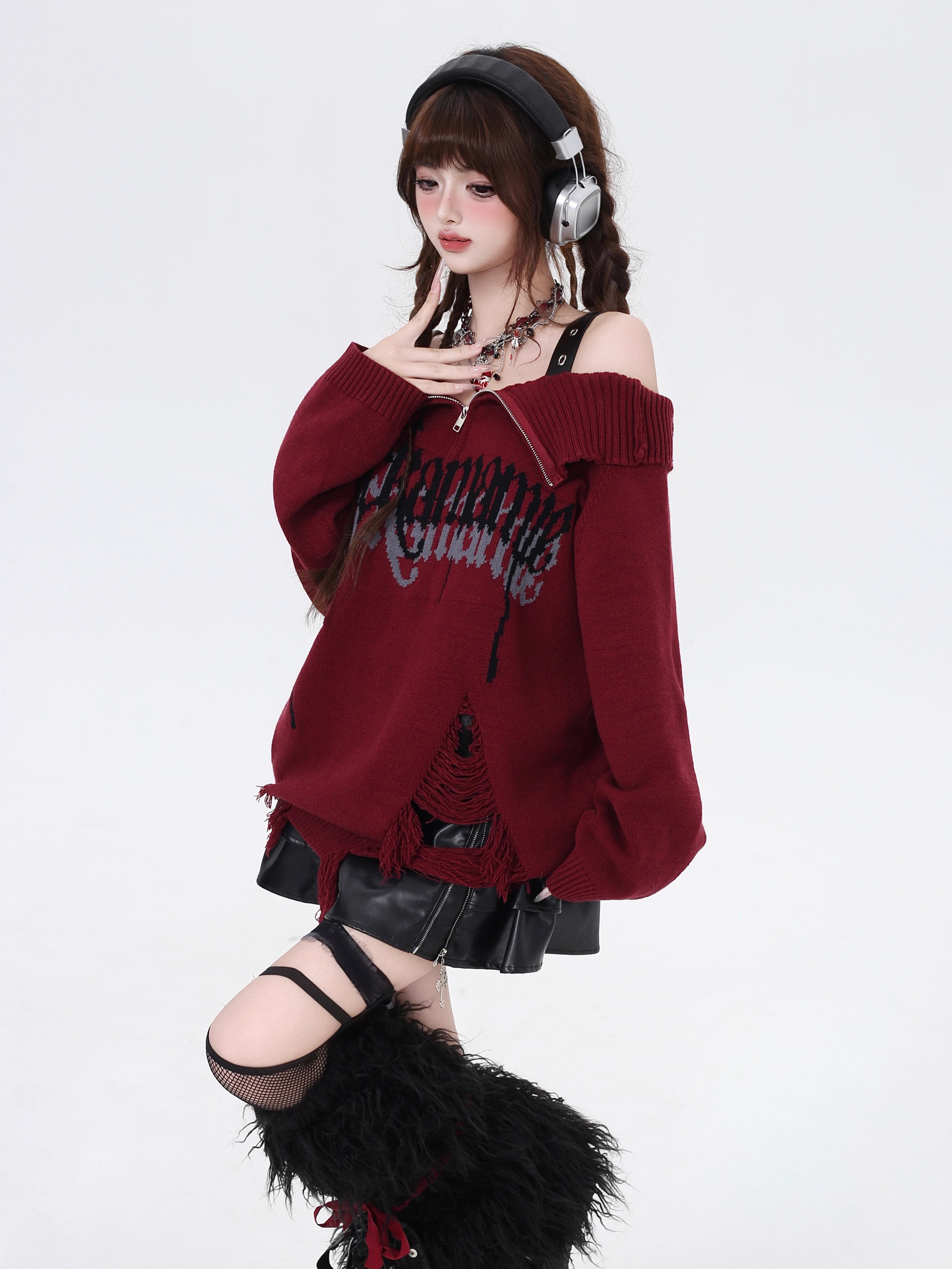 A daring twist on dark romance, this sweater blends gothic subversion with playful vibrancy. The structured zip collar frames off-shoulder styling for a bold yet elegant silhouette, while the unexpected red and pink hues reinterpret traditional gothic tones. Lightweight yet textured knit offers versatility for layered winter wear. For those who embrace contrast—where edge meets elegance, and rebellion meets softness.