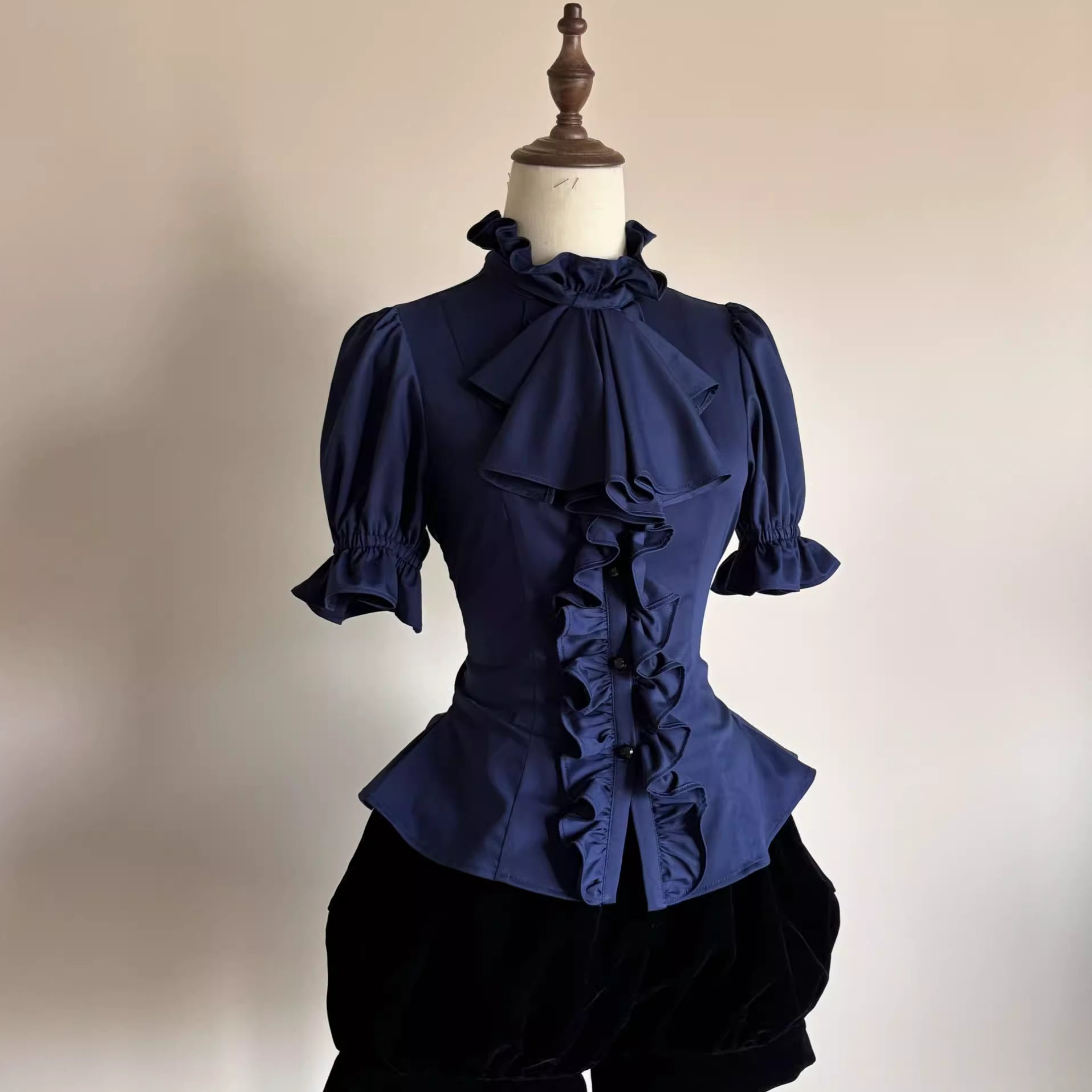 This striking Klein blue Lolita shirt redefines Gothic elegance with its bold fusion of medieval prince aesthetics and contemporary dark fashion. The short sleeve design features intricate ruffles and Victorian-inspired tailoring, creating a dramatic yet wearable statement piece. The vibrant Klein blue hue contrasts brilliantly with classic Gothic elements, offering a modern twist on aristocratic style. Perfect for layering or standalone wear, it embodies luxurious rebellion—ideal for those seeking to merge