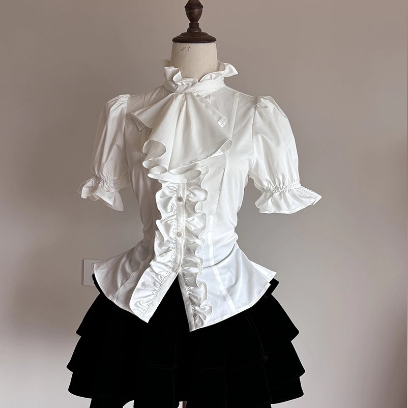 This striking Klein blue Lolita shirt redefines Gothic elegance with its bold fusion of medieval prince aesthetics and contemporary dark fashion. The short sleeve design features intricate ruffles and Victorian-inspired tailoring, creating a dramatic yet wearable statement piece. The vibrant Klein blue hue contrasts brilliantly with classic Gothic elements, offering a modern twist on aristocratic style. Perfect for layering or standalone wear, it embodies luxurious rebellion—ideal for those seeking to merge