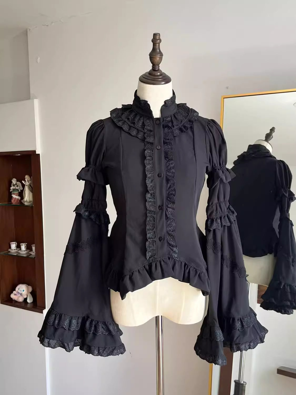 Design Concept:
This Gothic Lolita blouse features a lightweight, soft fabric with vintage-style lantern sleeves and a slim, prince-inspired silhouette. Offered in both black and white, it can be effortlessly styled with various Lolita skirts or layered under outerwear. Combining elegance with comfort, it’s ideal for everyday wear, themed tea parties, or cosplay events.