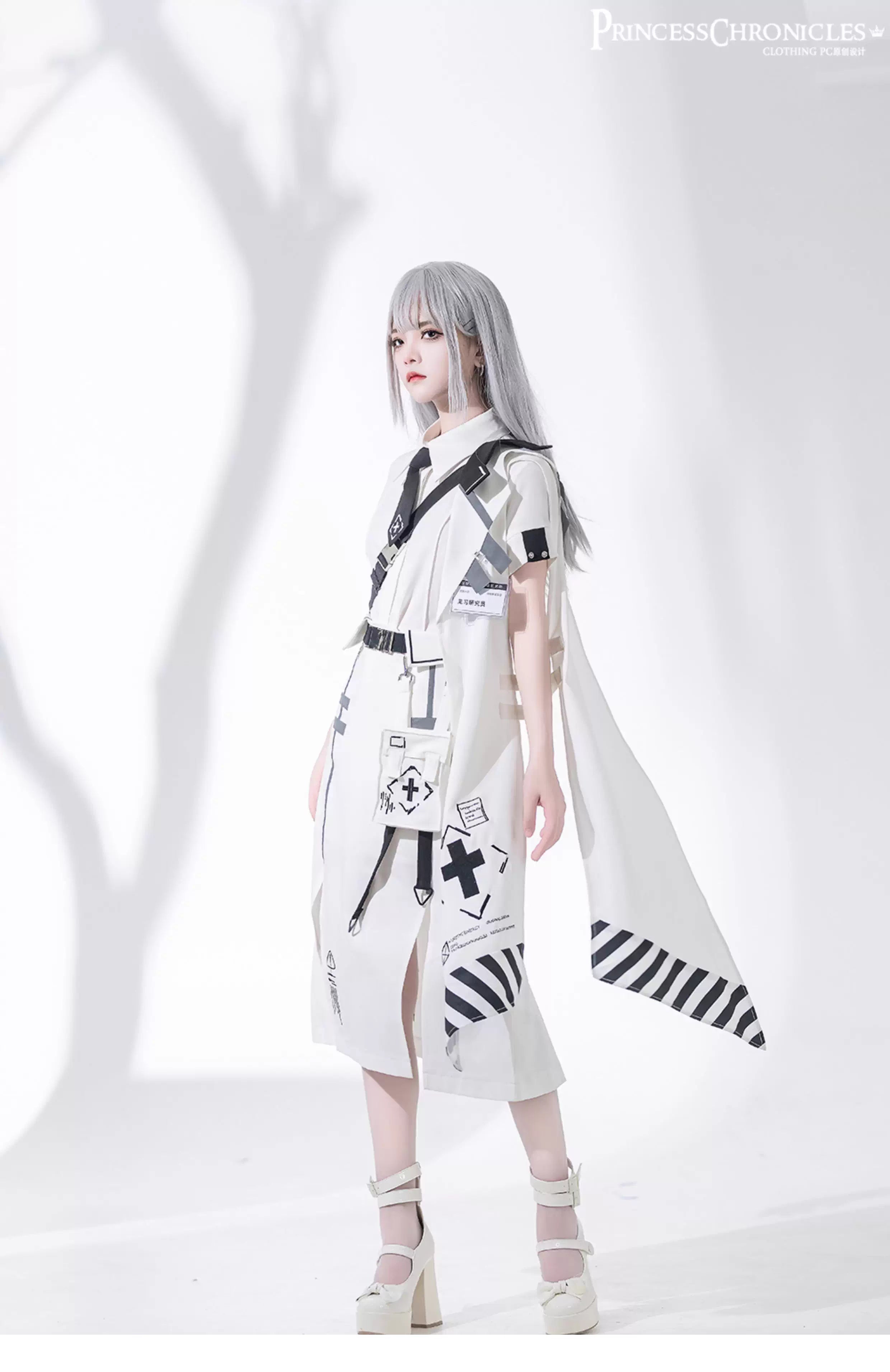 This stark white techwear shirt merges cyberpunk functionality with minimalist purity. Designed with modular seams, hidden pockets, and breathable performance fabric, it balances urban utility and sleek aesthetics. Angular cuts and asymmetrical details evoke digital frost, while the crisp white hue reflects a futuristic versatility—perfect for layered dystopian elegance or standalone statement.