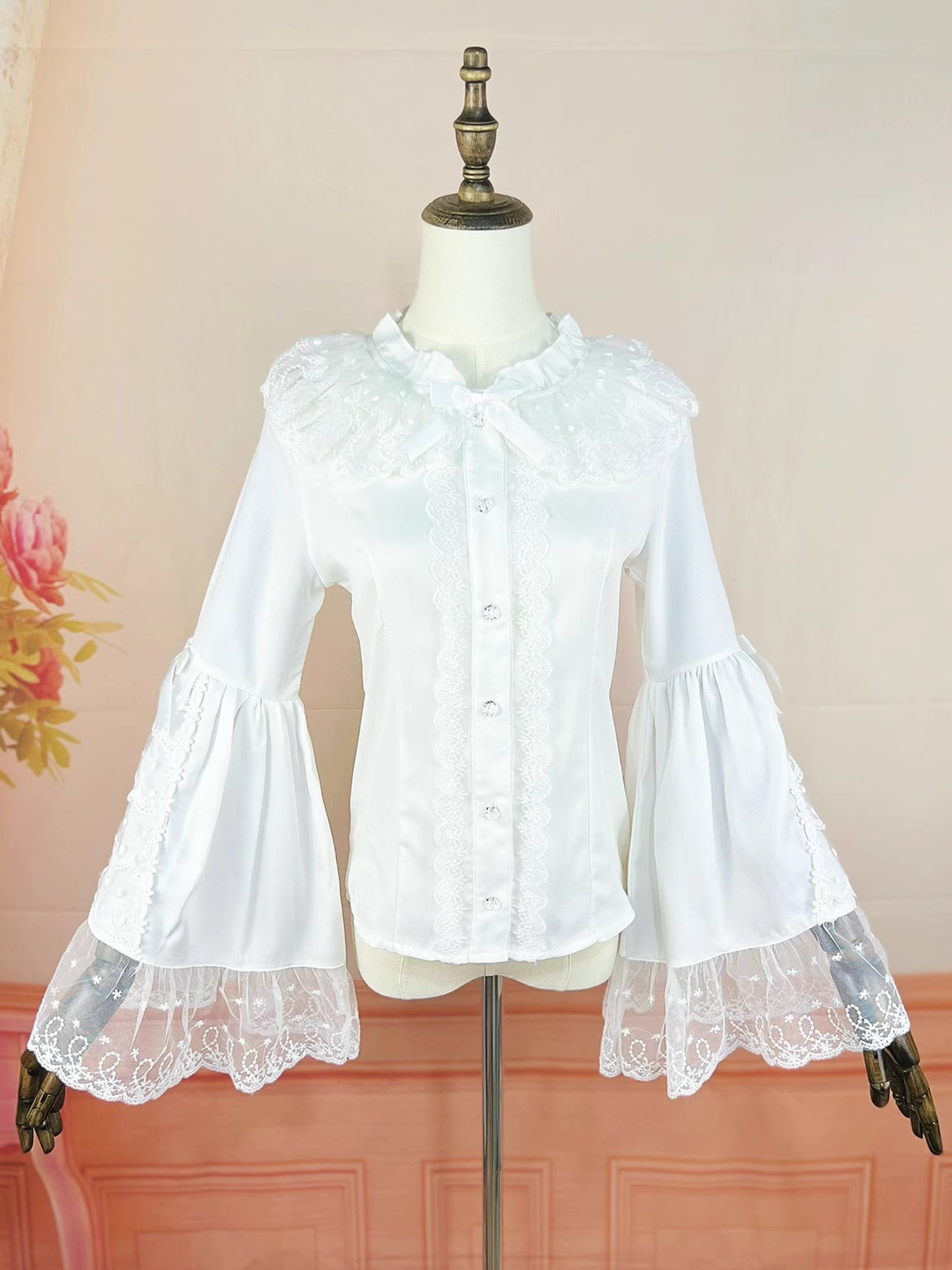 Design Concept:
This Lolita blouse in ivory white captures the elegance of vintage court style. Designed with delicate lace details and graceful flare princess sleeves, it creates a refined silhouette that enhances any Lolita outfit. The slim-fit tailoring complements JSKs and skirts, making it both functional and decorative as an inner layer. Crafted from soft chiffon for comfort, this blouse is perfect for daily wear or tea party occasions, blending luxury with timeless charm.