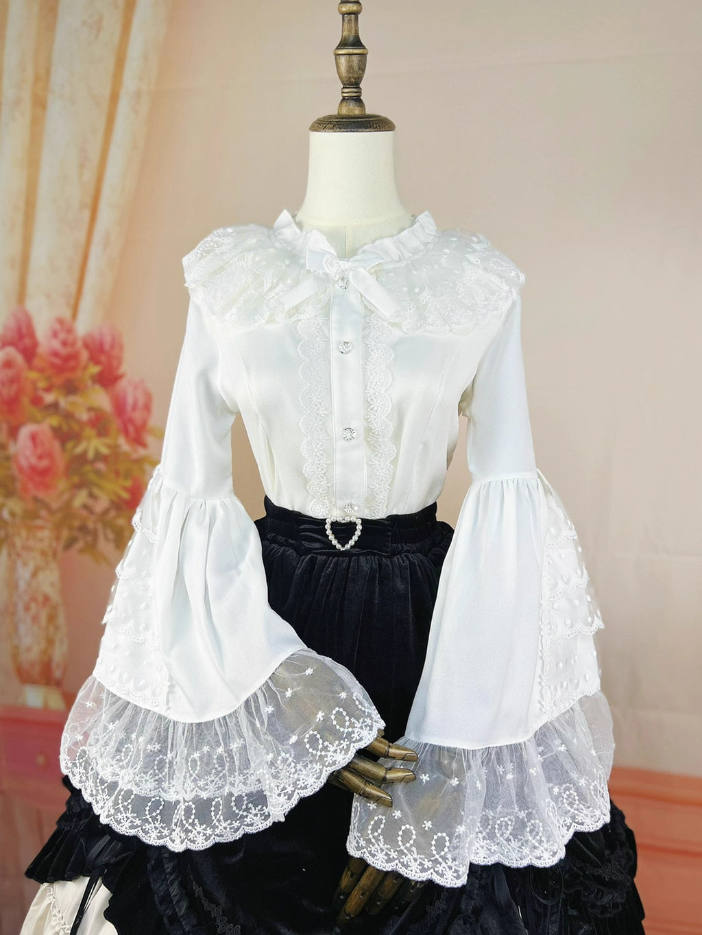Design Concept:
This Lolita blouse in ivory white captures the elegance of vintage court style. Designed with delicate lace details and graceful flare princess sleeves, it creates a refined silhouette that enhances any Lolita outfit. The slim-fit tailoring complements JSKs and skirts, making it both functional and decorative as an inner layer. Crafted from soft chiffon for comfort, this blouse is perfect for daily wear or tea party occasions, blending luxury with timeless charm.