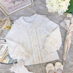 This charming blouse blends JK style with sweet Lolita details for a truly adorable look. The classic Peter Pan collar and delicate lace trim offer timeless appeal, while the playful bubble sleeves add a touch of whimsy. Perfect for layering under jumperskirts or wearing on its own, this versatile piece is crafted from soft, comfortable fabric. Its cute design makes it ideal for creating innocent and romantic coordinates that capture the essence of youthful elegance.