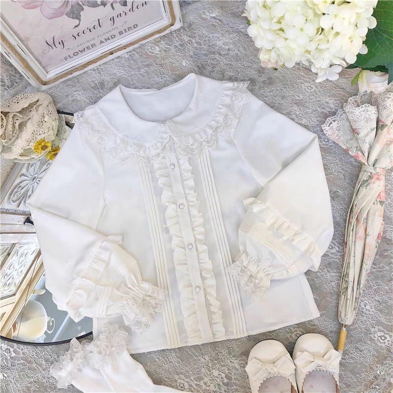 This charming blouse blends JK style with sweet Lolita details for a truly adorable look. The classic Peter Pan collar and delicate lace trim offer timeless appeal, while the playful bubble sleeves add a touch of whimsy. Perfect for layering under jumperskirts or wearing on its own, this versatile piece is crafted from soft, comfortable fabric. Its cute design makes it ideal for creating innocent and romantic coordinates that capture the essence of youthful elegance.