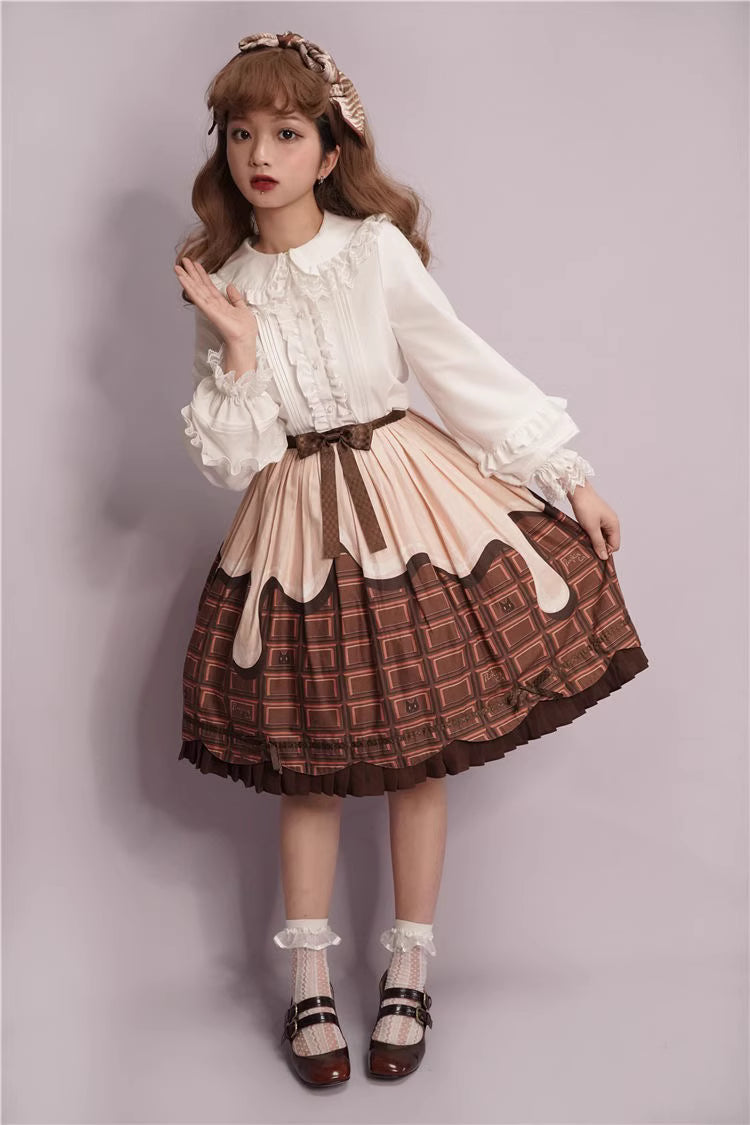 This charming blouse blends JK style with sweet Lolita details for a truly adorable look. The classic Peter Pan collar and delicate lace trim offer timeless appeal, while the playful bubble sleeves add a touch of whimsy. Perfect for layering under jumperskirts or wearing on its own, this versatile piece is crafted from soft, comfortable fabric. Its cute design makes it ideal for creating innocent and romantic coordinates that capture the essence of youthful elegance.