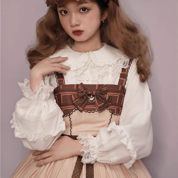 This charming blouse blends JK style with sweet Lolita details for a truly adorable look. The classic Peter Pan collar and delicate lace trim offer timeless appeal, while the playful bubble sleeves add a touch of whimsy. Perfect for layering under jumperskirts or wearing on its own, this versatile piece is crafted from soft, comfortable fabric. Its cute design makes it ideal for creating innocent and romantic coordinates that capture the essence of youthful elegance.