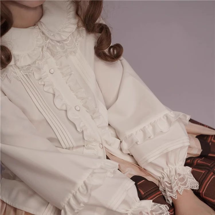 This charming blouse blends JK style with sweet Lolita details for a truly adorable look. The classic Peter Pan collar and delicate lace trim offer timeless appeal, while the playful bubble sleeves add a touch of whimsy. Perfect for layering under jumperskirts or wearing on its own, this versatile piece is crafted from soft, comfortable fabric. Its cute design makes it ideal for creating innocent and romantic coordinates that capture the essence of youthful elegance.