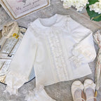 This charming blouse blends JK style with sweet Lolita details for a truly adorable look. The classic Peter Pan collar and delicate lace trim offer timeless appeal, while the playful bubble sleeves add a touch of whimsy. Perfect for layering under jumperskirts or wearing on its own, this versatile piece is crafted from soft, comfortable fabric. Its cute design makes it ideal for creating innocent and romantic coordinates that capture the essence of youthful elegance.