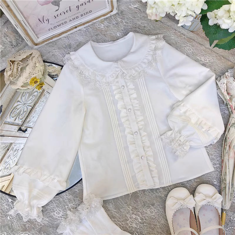 This charming blouse blends JK style with sweet Lolita details for a truly adorable look. The classic Peter Pan collar and delicate lace trim offer timeless appeal, while the playful bubble sleeves add a touch of whimsy. Perfect for layering under jumperskirts or wearing on its own, this versatile piece is crafted from soft, comfortable fabric. Its cute design makes it ideal for creating innocent and romantic coordinates that capture the essence of youthful elegance.