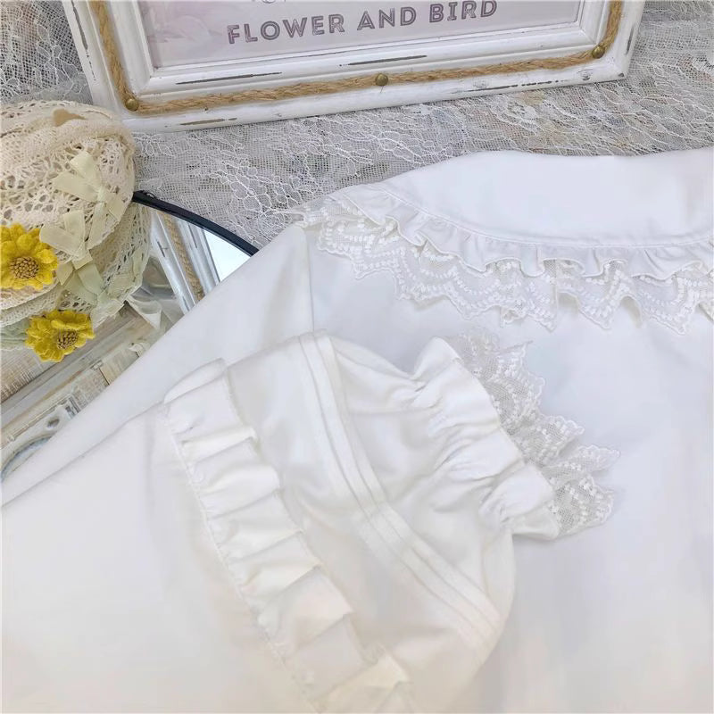 This charming blouse blends JK style with sweet Lolita details for a truly adorable look. The classic Peter Pan collar and delicate lace trim offer timeless appeal, while the playful bubble sleeves add a touch of whimsy. Perfect for layering under jumperskirts or wearing on its own, this versatile piece is crafted from soft, comfortable fabric. Its cute design makes it ideal for creating innocent and romantic coordinates that capture the essence of youthful elegance.