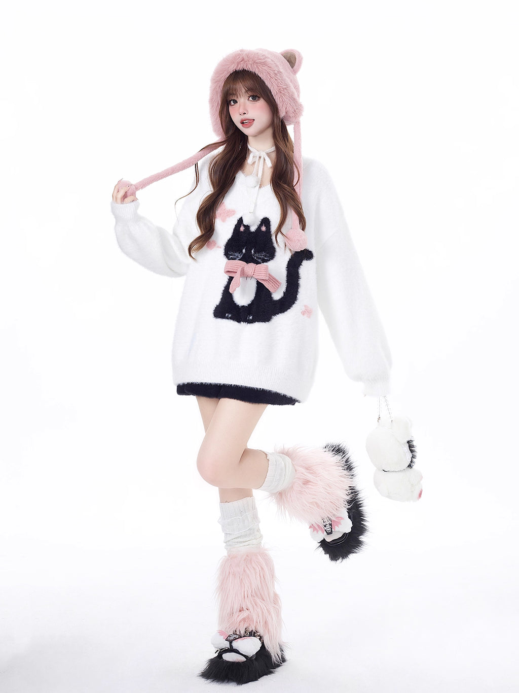 Designed for cozy moments and holiday charm, this ultra-soft ribbed sweater features a delicate kitten-inspired bow detail and a relaxed fit that feels like a warm hug. The classic white and red color blend brings a festive yet gentle vibe, perfect for layering or wearing solo. Whether curled up by the fire or celebrating with friends, this piece wraps you in comfort and quiet elegance—just like a content little cat.