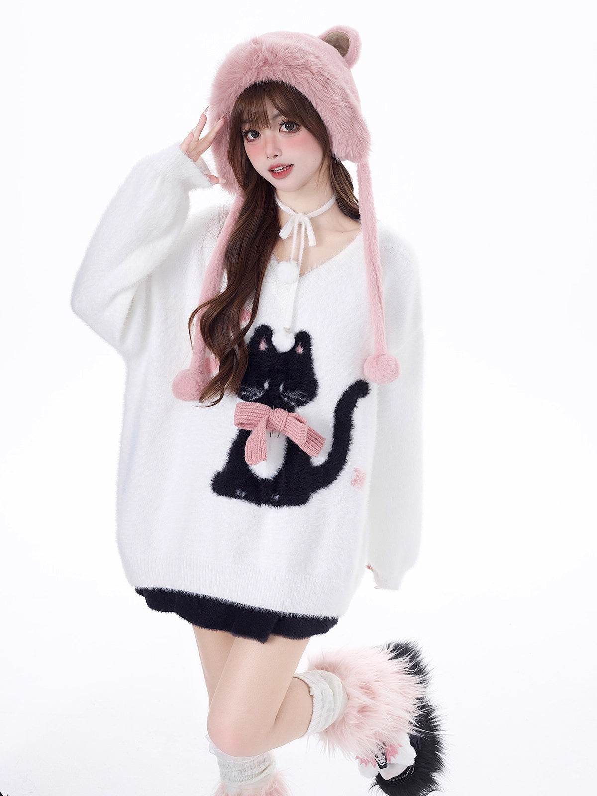 Designed for cozy moments and holiday charm, this ultra-soft ribbed sweater features a delicate kitten-inspired bow detail and a relaxed fit that feels like a warm hug. The classic white and red color blend brings a festive yet gentle vibe, perfect for layering or wearing solo. Whether curled up by the fire or celebrating with friends, this piece wraps you in comfort and quiet elegance—just like a content little cat.