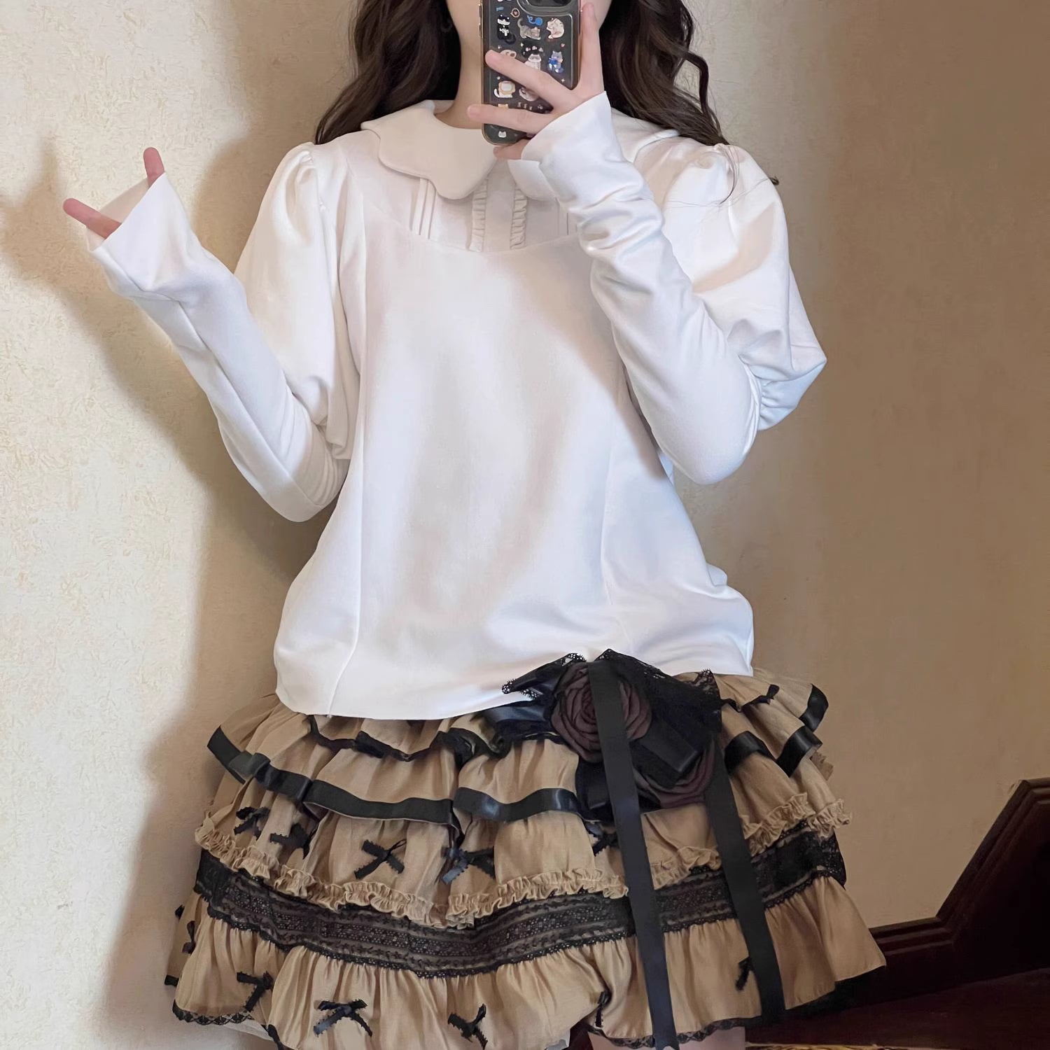 Indulge in sweet comfort with our Milk Puff Lolita blouse! This cozy fleece-lined top features an adorable Peter Pan collar trimmed with delicate lace, perfect for pairing with JSKs during cooler weather. The classic black and white color scheme offers versatile styling options for both classic and sweet Lolita coordinates. Designed for both warmth and style, this charming blouse combines kawaii aesthetics with practical comfort, making it your go-to choice for winter tea parties and festive gatherings.