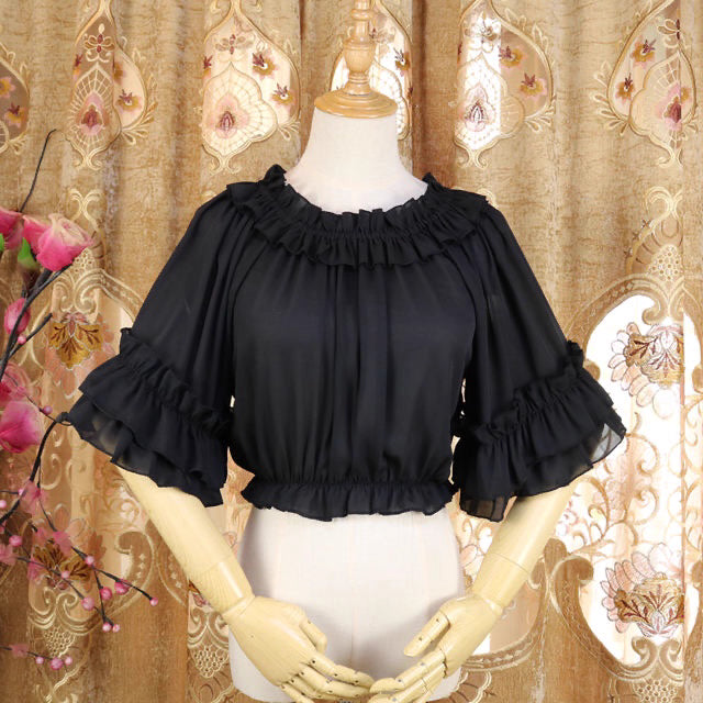 Design Concept:
This Lolita blouse captures a playful yet elegant summer aesthetic with its off-shoulder square neckline and delicate ruffle trims. The short-sleeve, loose-fit design ensures both comfort and style, making it an essential layering piece for Lolita wardrobes. Available in White and Black, it offers versatile choices for sweet or Gothic-inspired looks.