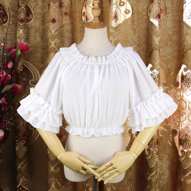Design Concept:
This Lolita blouse captures a playful yet elegant summer aesthetic with its off-shoulder square neckline and delicate ruffle trims. The short-sleeve, loose-fit design ensures both comfort and style, making it an essential layering piece for Lolita wardrobes. Available in White and Black, it offers versatile choices for sweet or Gothic-inspired looks.