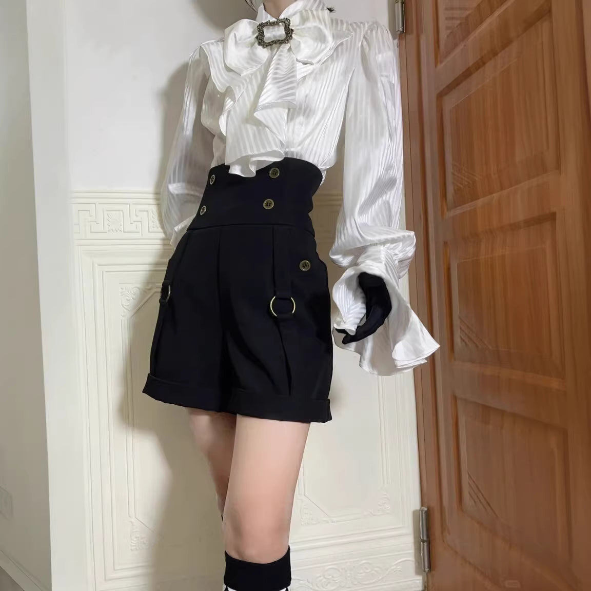 Design Concept:

This Lolita blouse in purple, white, and black blends Gothic charm with French vintage elegance. Designed with delicate tailoring and long sleeves, it creates a dramatic yet refined silhouette that is perfect for layering under Lolita dresses or wearing as a statement piece on its own. The versatile design makes it suitable for tea parties, cosplay events, and vintage-inspired gatherings, while the soft fabric ensures both comfort and style.
