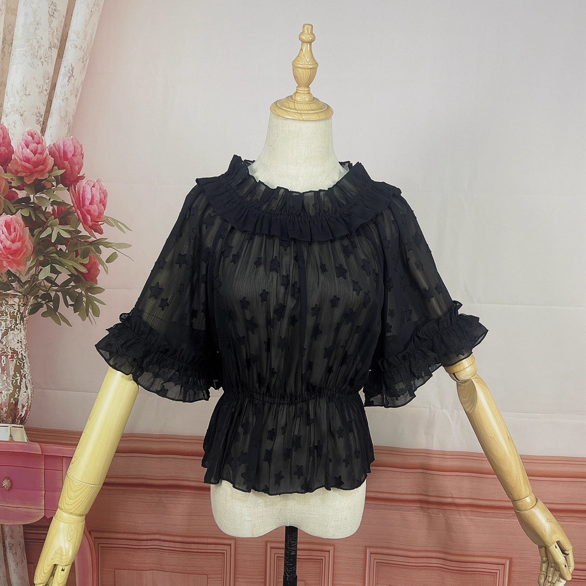 Delve into dreamy elegance with this Lolita chiffon blouse. Delicate prints adorn the lightweight, sheer fabric, while the elastic neckline offers a comfortable yet chic fit. Designed as a crop top, it pairs perfectly with JSK dresses, adding a layer of ethereal charm. The short sleeves and breathable material make it ideal for summer wear. Embrace a blend of whimsy and sophistication, perfect for creating a captivating Lolita ensemble that’s both graceful and stylish.
