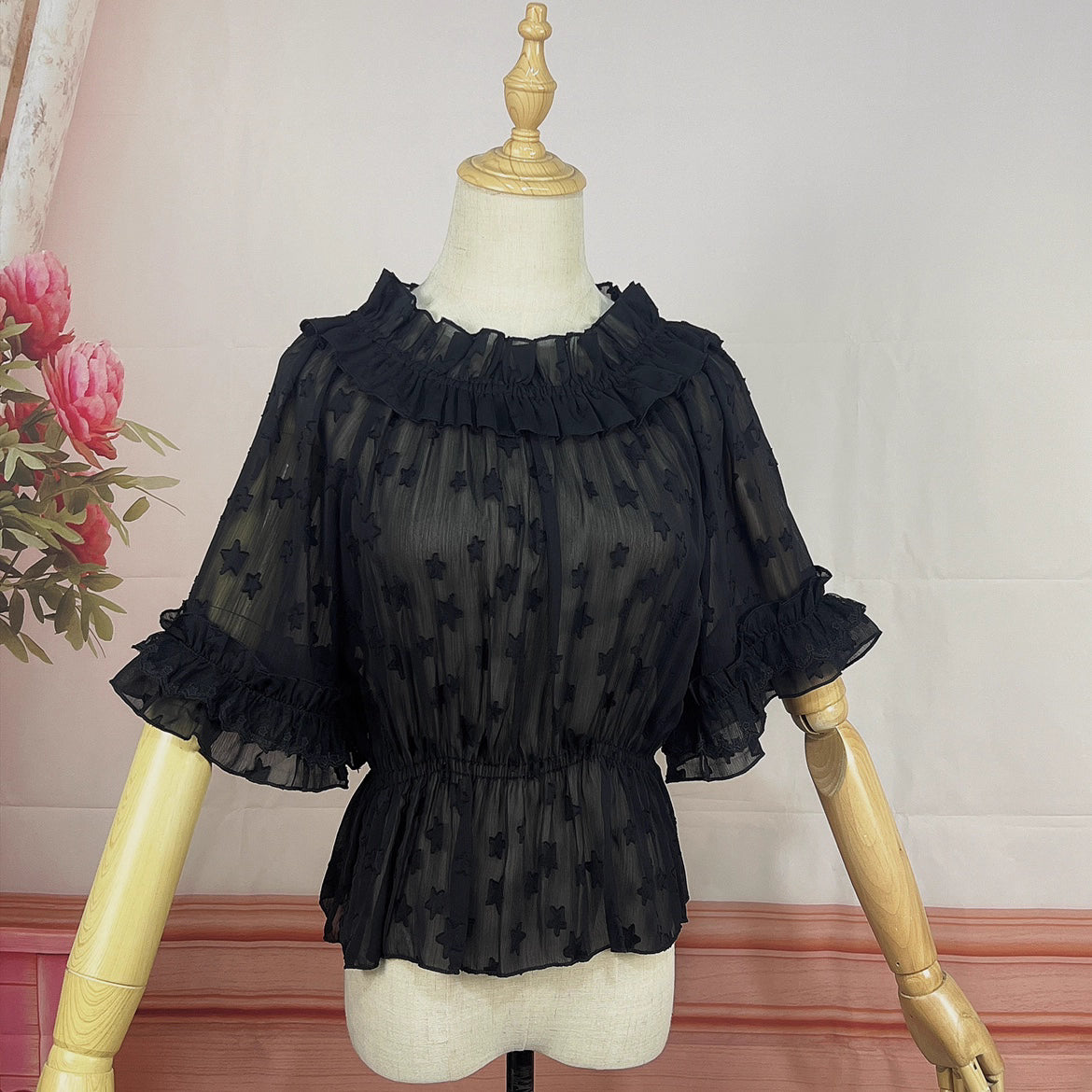 Delve into dreamy elegance with this Lolita chiffon blouse. Delicate prints adorn the lightweight, sheer fabric, while the elastic neckline offers a comfortable yet chic fit. Designed as a crop top, it pairs perfectly with JSK dresses, adding a layer of ethereal charm. The short sleeves and breathable material make it ideal for summer wear. Embrace a blend of whimsy and sophistication, perfect for creating a captivating Lolita ensemble that’s both graceful and stylish.